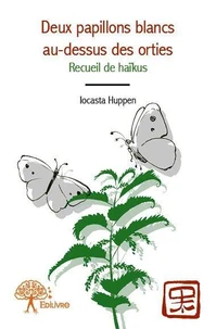 Deux papillons blancs au dessus des orties