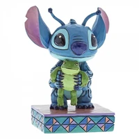 Stitch with frog figurine