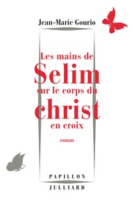 Jean-Marie Gourio - Les mains de Selim sur le corps du Christ en croix.