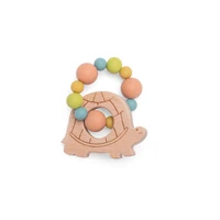 Hochet anneau de dentition bois et silicone tortue trois petits lapins